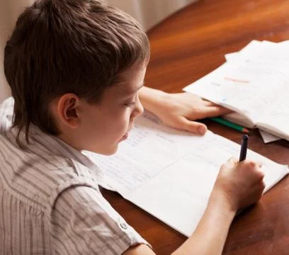 Boy doing homework Stock Photos