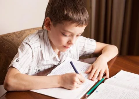 Boy doing homework Stock Photos
