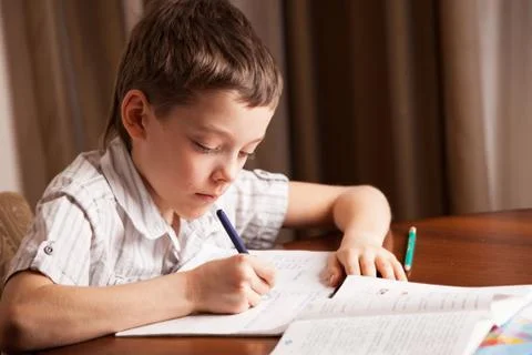 Boy doing homework Stock Photos