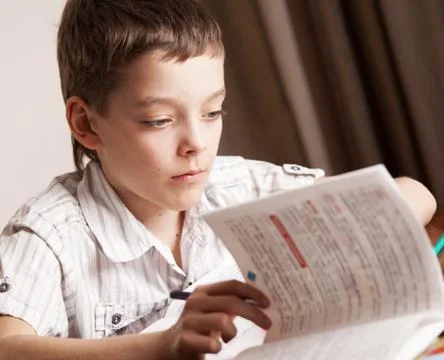 Boy doing homework Stock Photos