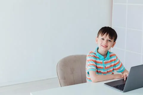 Boy doing learning task at school on computer Stock Photos