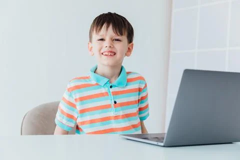Boy doing learning task at school on computer Foto stock