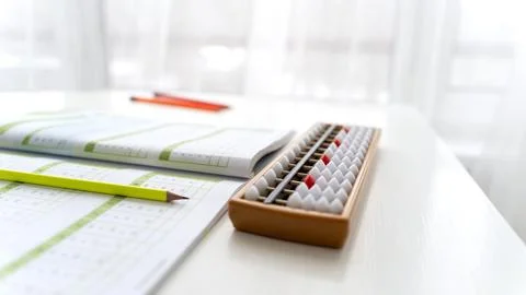 Boy doing mental arithmetic on abacus Stock Photos