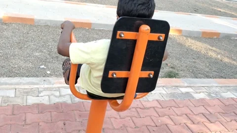A boy is doing physical exercise with wellness machine - HD(4k video) Stock Footage 232902562