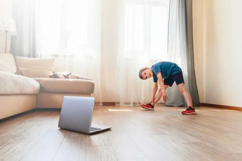 The boy doing physical exercises. Stock Photos