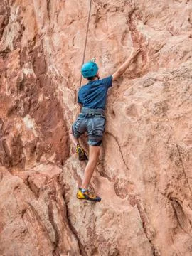 A boy doing rock climbing Stock Photos