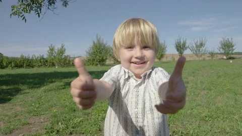 Boy Double Thumbs Up Laugh - 4k - Slow motion Stock Footage 71502262