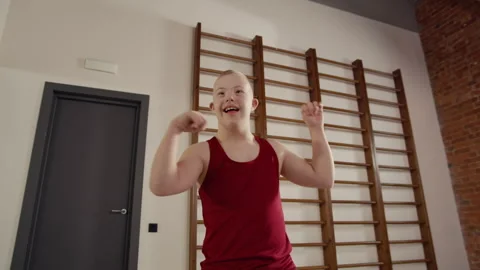 Boy with Down Syndrome Dancing in Spacious Studio Stock Footage 326638072