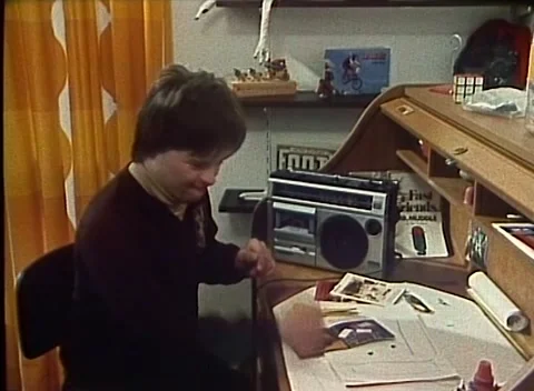 Boy With Down Syndrome at Desk / Homework (1978) Stock Footage 162451571