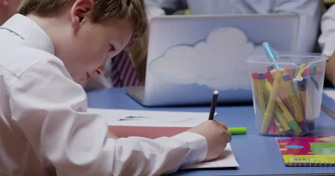 Boy drawing in classroom Stock Footage 58574470
