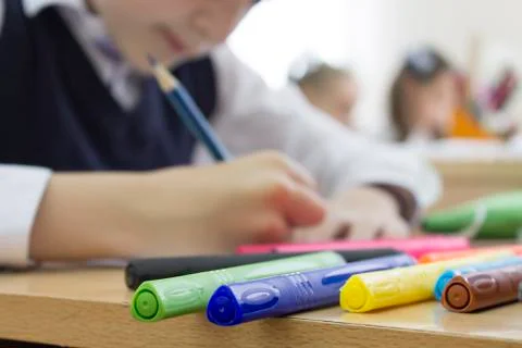 A boy is drawing with a marker Stock Photos