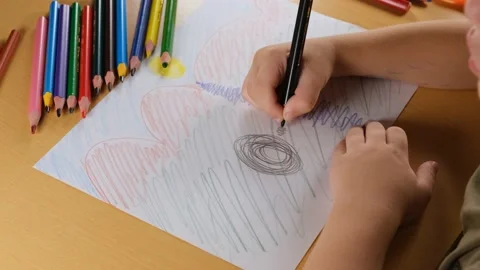 Boy drawing on paper Stock Footage 224547546