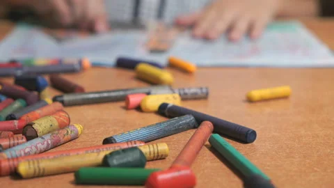 Boy drawing pictures using chalks and pencils 스톡 동영상 87850953
