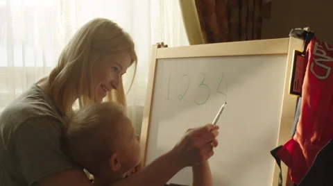 Boy Drawing Scribbles on the Marker Board Video stock 60360764