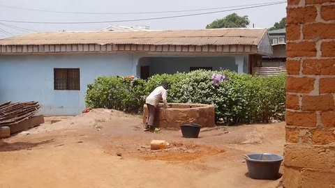 Boy drawing water from the well 2 Stock Footage 80367296