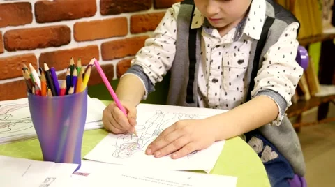 Boy draws with colored pencils Stock Footage 48941719
