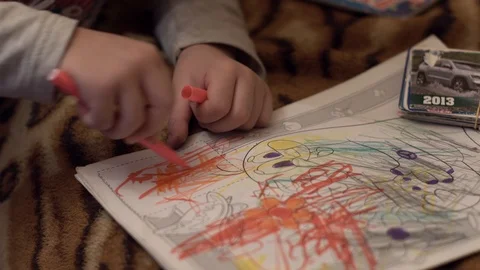 Boy draws a coloring book Stock Footage 125177253