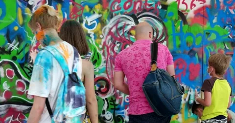 Boy draws graffiti Stock Footage 64820618