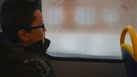 A boy draws a heart on the bus window. Love. Stock Footage 83297314
