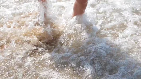 Boy draws his finger on the sand near the sea. Sea vacation for family with kids Stock Footage 113820067