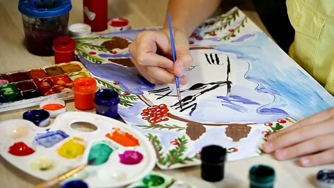 The boy draws a New Years drawing in gouache. Online school of drawing Stock Footage 153867496