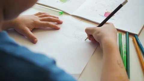 Boy draws paints with a pencil Stock-Footage 194858680