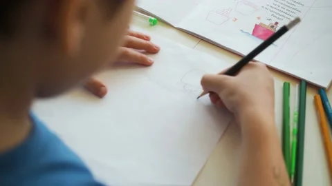 Boy draws paints with a pencil Stock-Footage 194858842