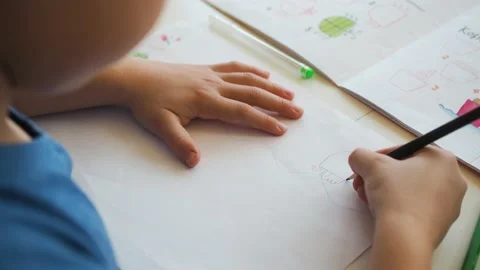 Boy draws paints with a pencil Stock Footage 194858878