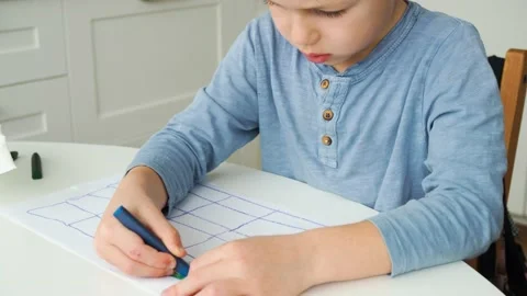 Boy draws paints with a pencil Stock Footage 197656928