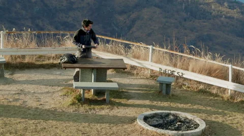 Boy draws the PC into a picnic area overview Stock Footage 59523332