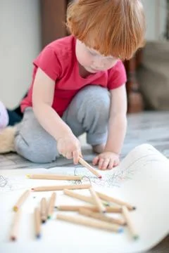 A boy draws with pencils Stock Photos