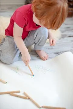 The boy draws scribbles Stock Photos