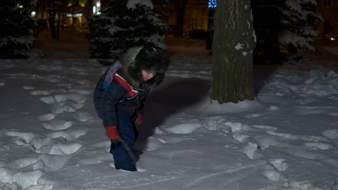 Boy draws on the snow Stock Footage 71753464