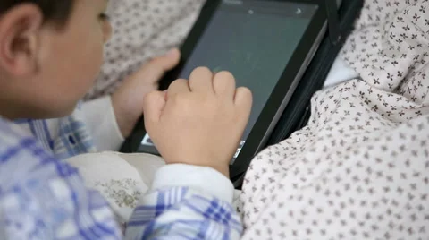 Boy draws on the tablet Stock Footage 44549496