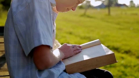 The boy is dreaming with a book Stock Footage 78022874