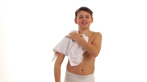 Boy dries himself with a towel Stock Footage 24633950