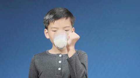 Boy drink milk Stock Footage 141837634