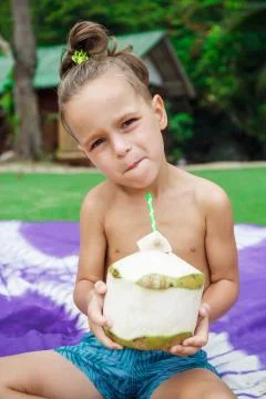 Boy drinking coconut 스톡 사진