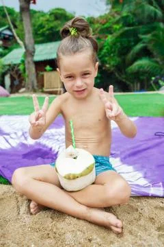Boy drinking coconut Stock Photos