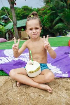Boy drinking coconut Stock Photos