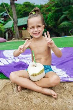 Boy drinking coconut Stock Photos