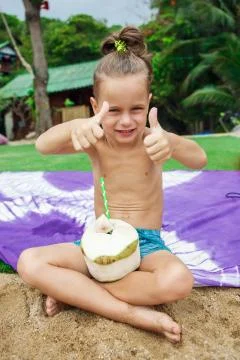 Boy drinking coconut Stock-Fotos