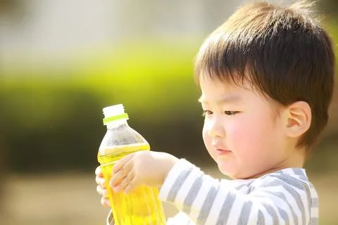 Boy drinking a drink Stock Photos