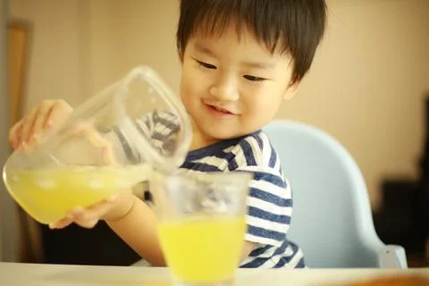 Boy drinking a drink Stock Photos