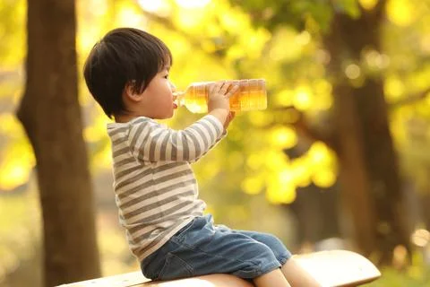 Boy drinking a drink Stock Photos