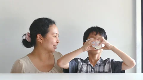 Boy drinking a glass of milk Stock Footage 56873257