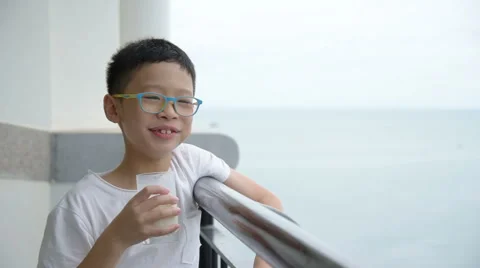 Boy drinking a glass of milk Stock Footage 67580085