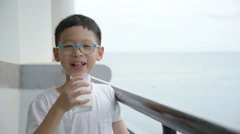 Boy drinking a glass of milk Stock Footage 67580103