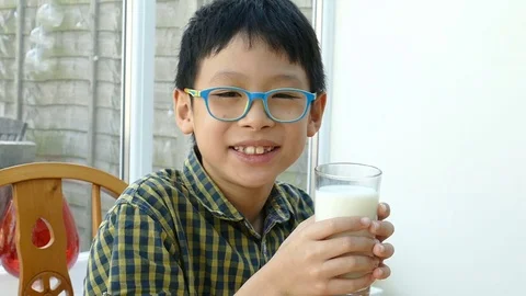 Boy drinking a glass of milk Stock Footage 70166123