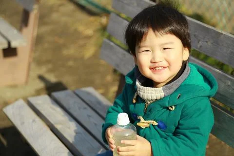 Boy drinking juice Stock Photos